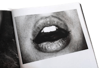 an open book with a photograph of a woman's mouth